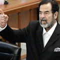 Saddam Hussein goes on trial.
